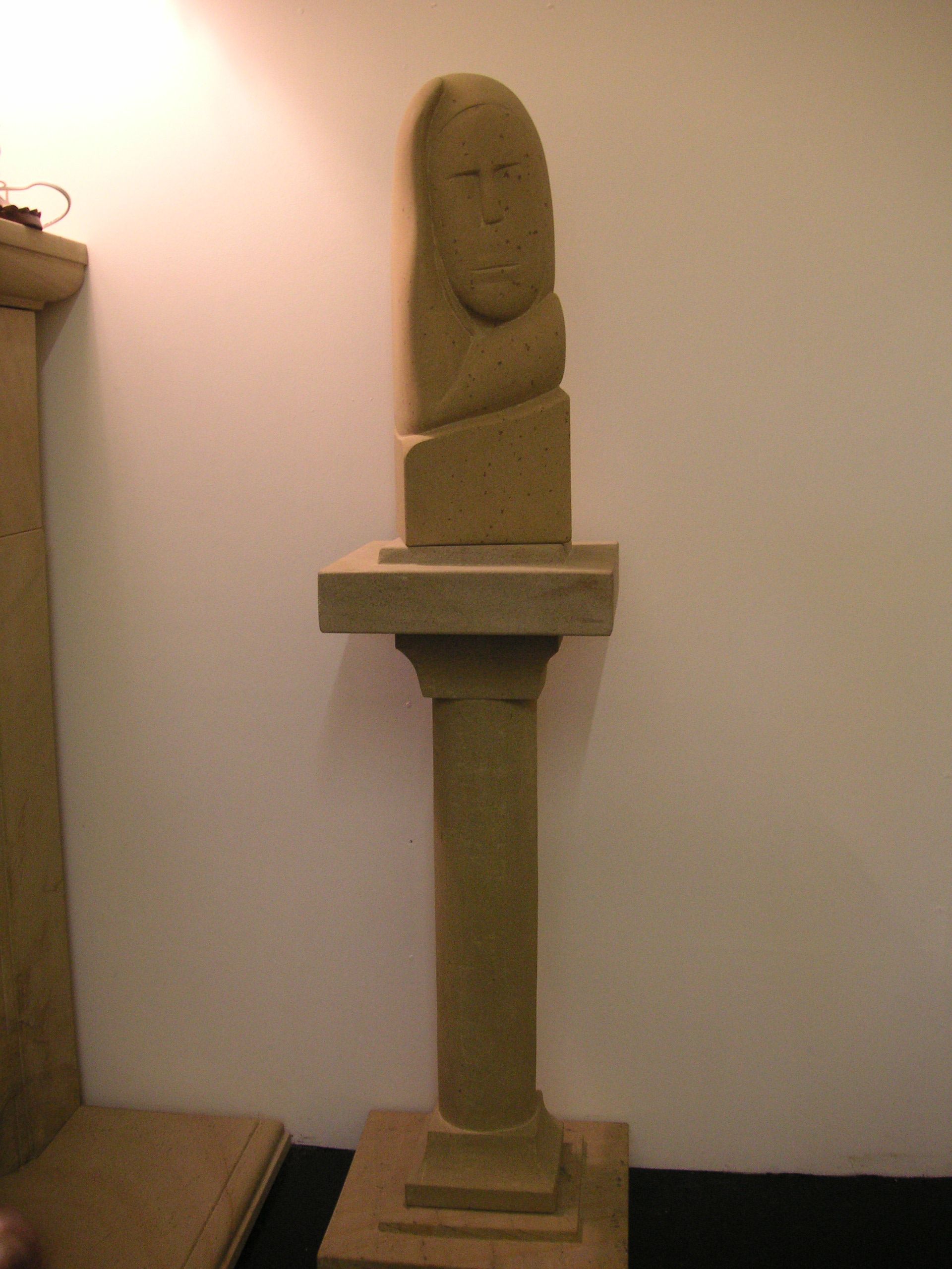 Stone pedestal with bust